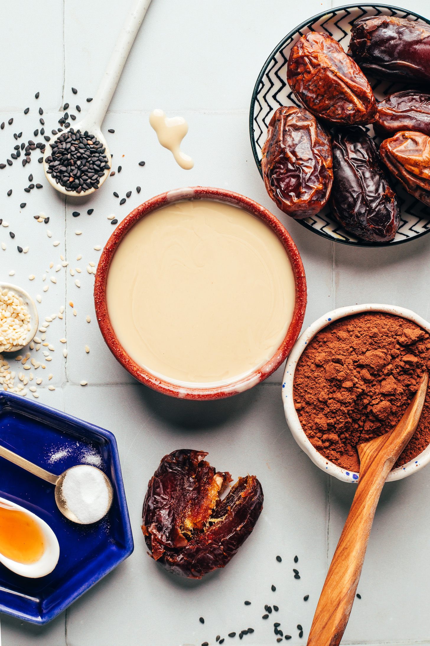 Dates, tahini, cocoa powder, salt, vanilla, and sesame seeds