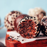 Close up shot of a bite of a vegan chocolate tahini truffle