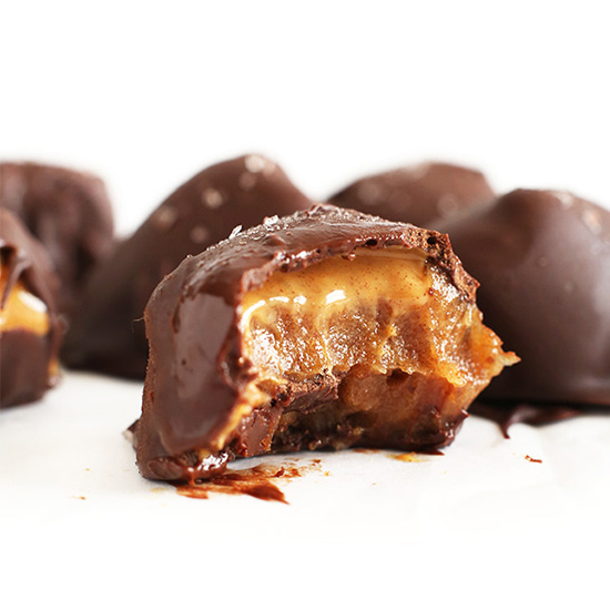 Partially eaten Caramel Peanut Butter Truffle for a decadent vegan dessert