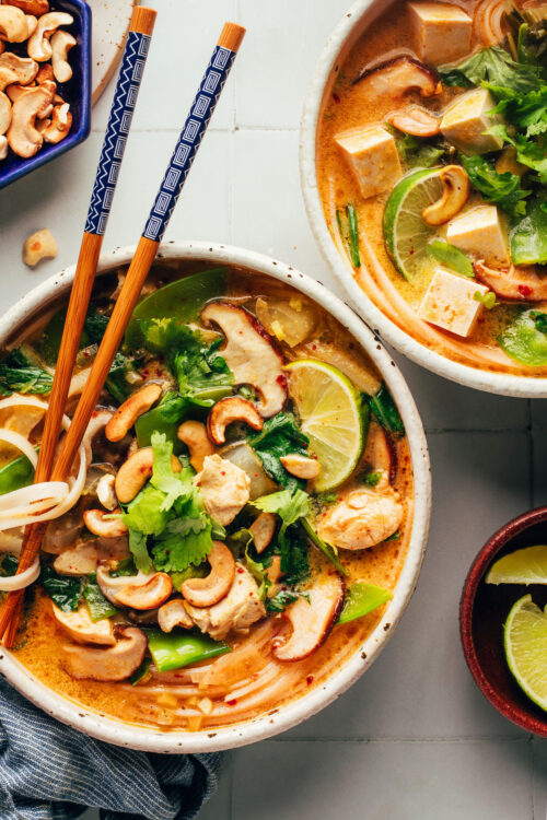 Chopsticks in a bowl of our cozy Thai-inspired curry noodle soup