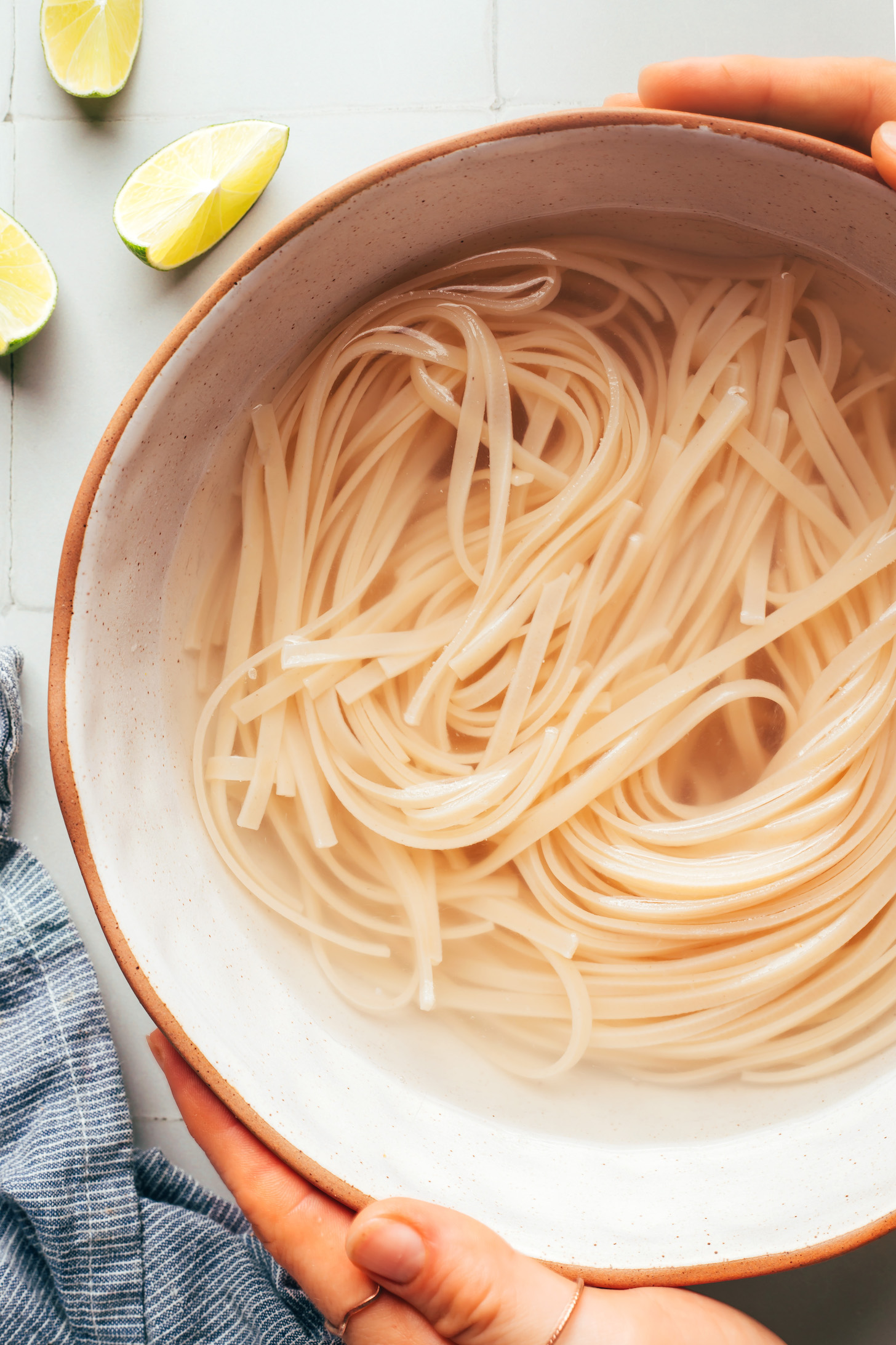 Soaking brown rice noodles in boiling water