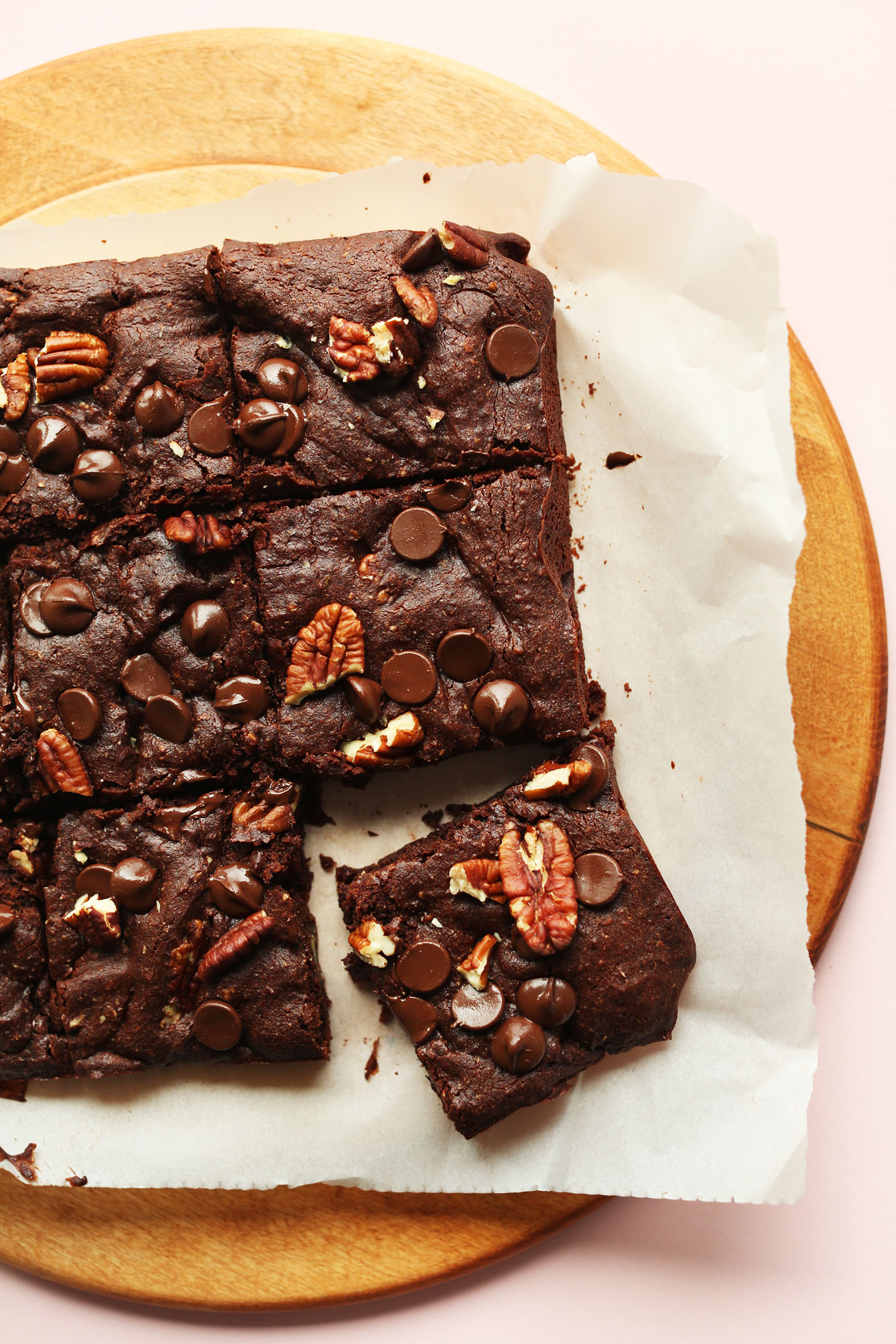 Stack of perfectly cut gluten-free vegan Brownies with pecans and dark chocolate chips