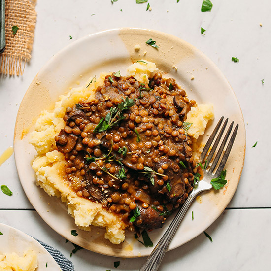 Plate of Lentil Mushroom Stew Over Mashed Potatoes