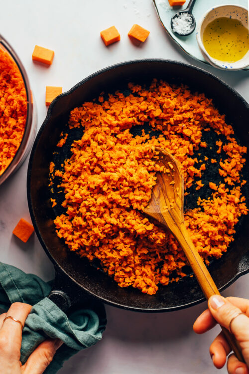 Sautéing sweet potato rice in a cast iron skillet