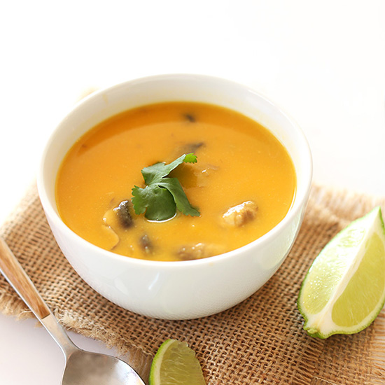 Bowl of Butternut Squash Tom Kha Gai Soup topped with cilantro