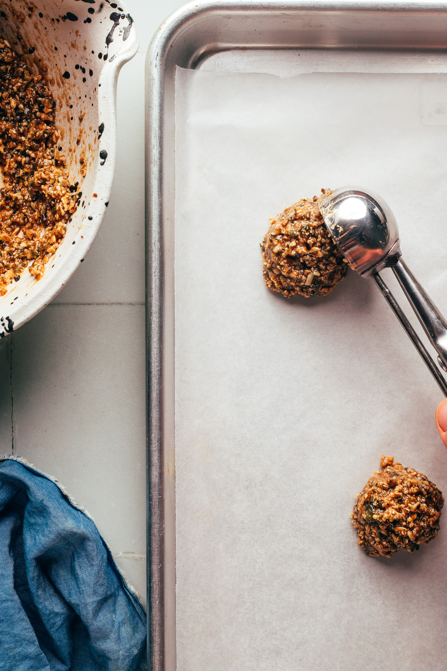 Scooping Florentine cookies onto a baking sheet